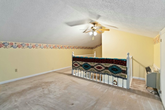 carpeted bedroom featuring ceiling fan, a textured ceiling, and lofted ceiling