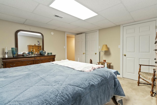 bedroom with light colored carpet