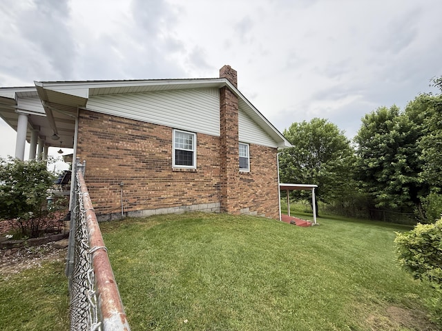 451 Parkside Rd, London, KY 40744 - view of side of home with brick siding, a chimney, and a yard