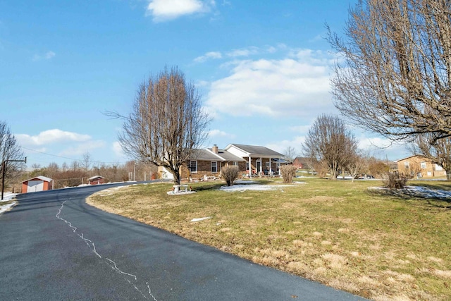 ranch-style house with a front yard