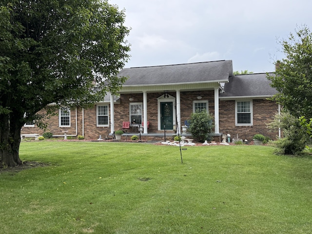 451 Parkside Rd, London, KY 40744 - view of front of house featuring brick siding, a front lawn, a porch, and a shingled roof