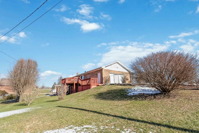 view of home's exterior featuring a deck and a lawn