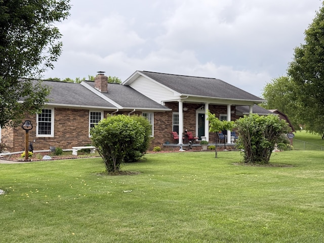 451 Parkside Rd, London, KY 40744 - view of front of property with brick siding, a front yard, and a chimney