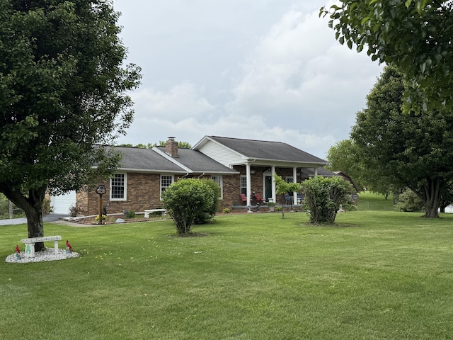 451 Parkside Rd, London, KY 40744 - view of front of home with a front yard, an attached garage, and a chimney