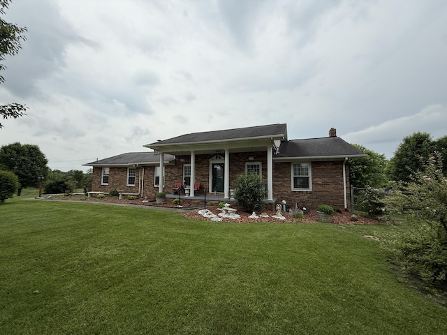 451 Parkside Rd, London, KY 40744 - view of front facade featuring a front lawn, a chimney, covered porch, and brick siding