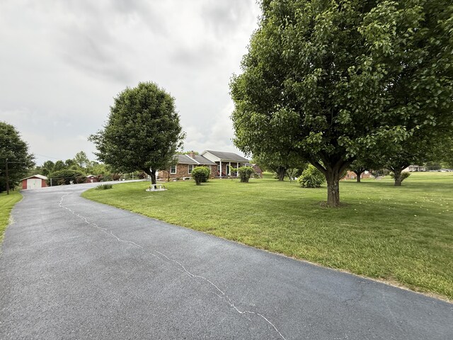 451 Parkside Rd, London, KY 40744 - view of front of property with a front lawn, a detached garage, and an outdoor structure