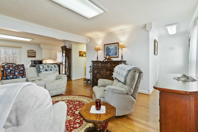 451 Parkside Rd, London, KY 40744 - living area featuring crown molding, light wood-style floors, and baseboards