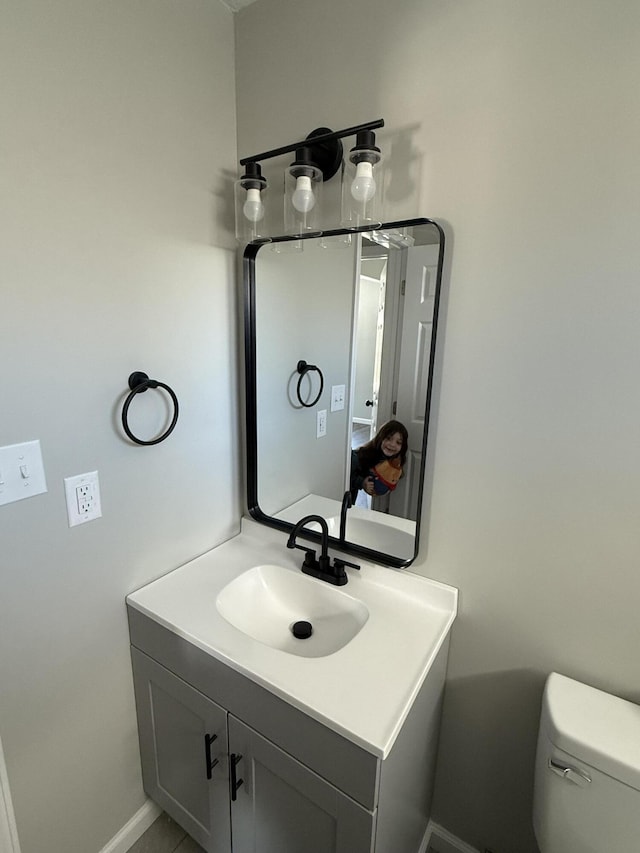 bathroom with vanity and toilet