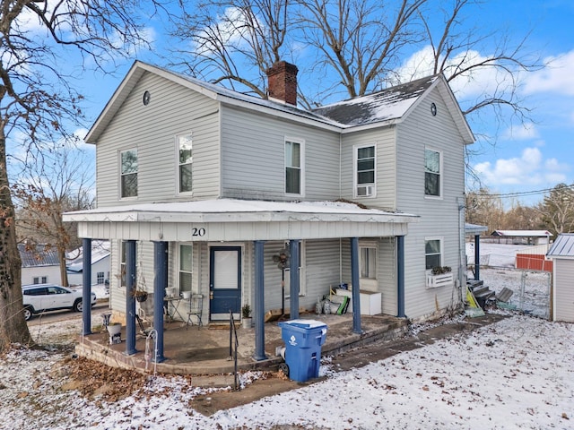 view of property featuring covered porch