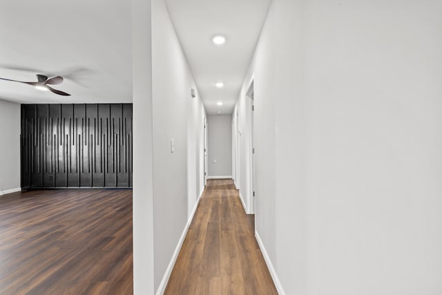 hallway featuring dark wood-type flooring