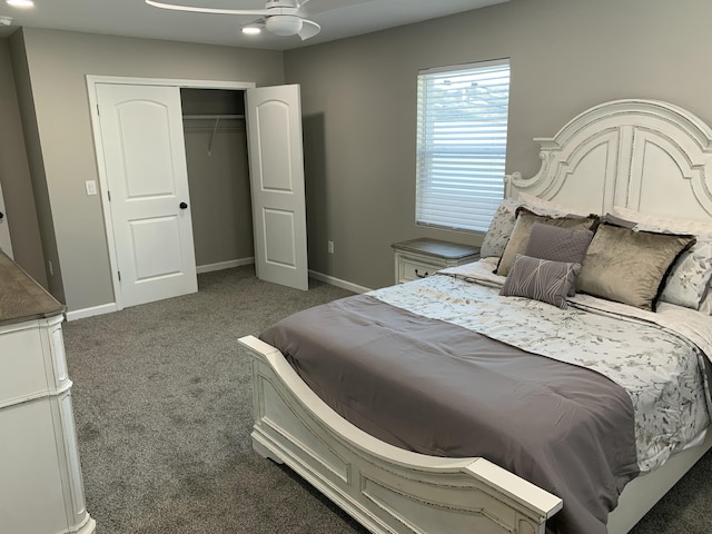 carpeted bedroom with ceiling fan and a closet