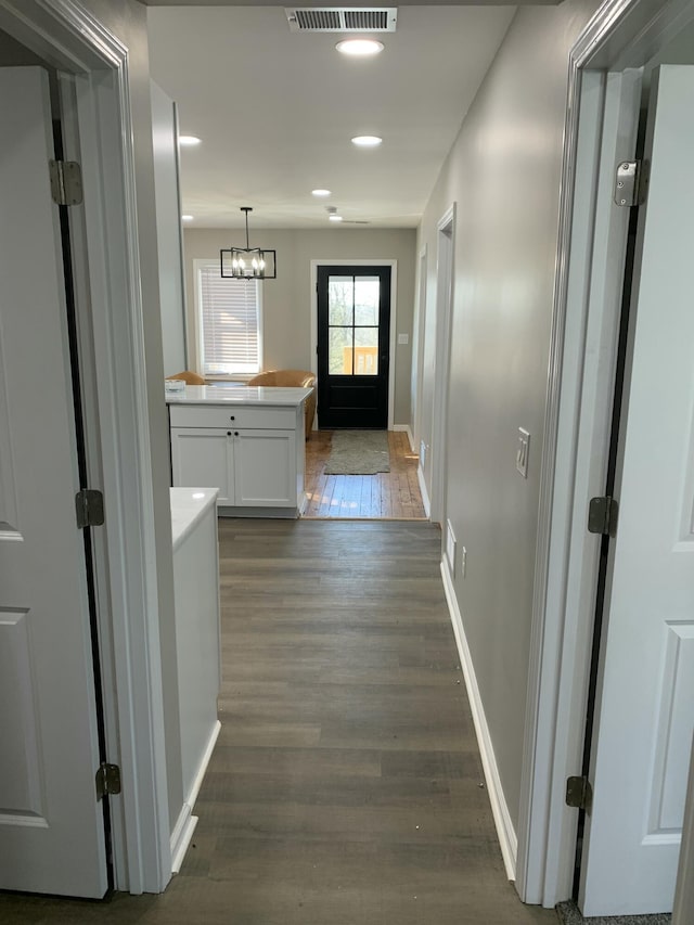 hallway featuring dark wood-type flooring