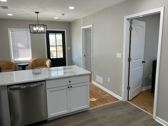 kitchen with dishwasher, hanging light fixtures, light stone countertops, white cabinets, and dark hardwood / wood-style flooring