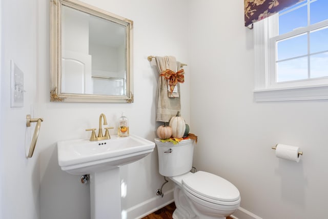 bathroom with toilet and sink