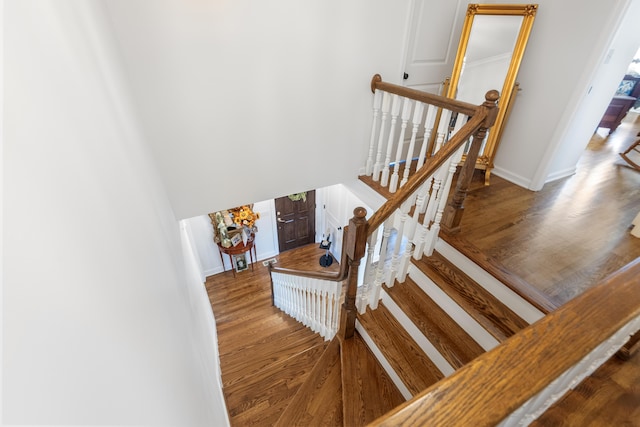 stairway featuring wood-type flooring