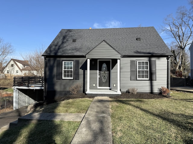 bungalow-style house featuring a front yard