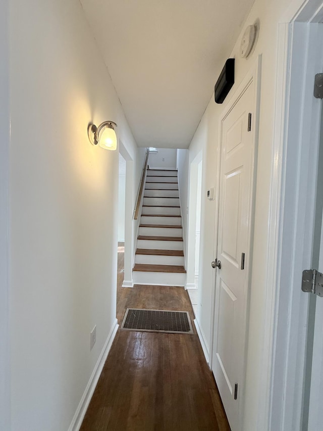 corridor featuring dark hardwood / wood-style flooring