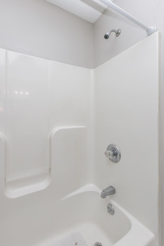 bathroom with shower / tub combination