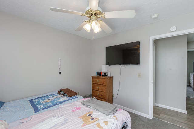 carpeted bedroom featuring a closet and ceiling fan