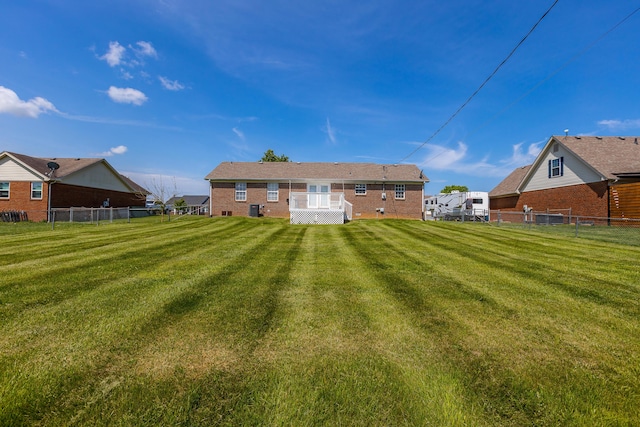 back of house with a lawn