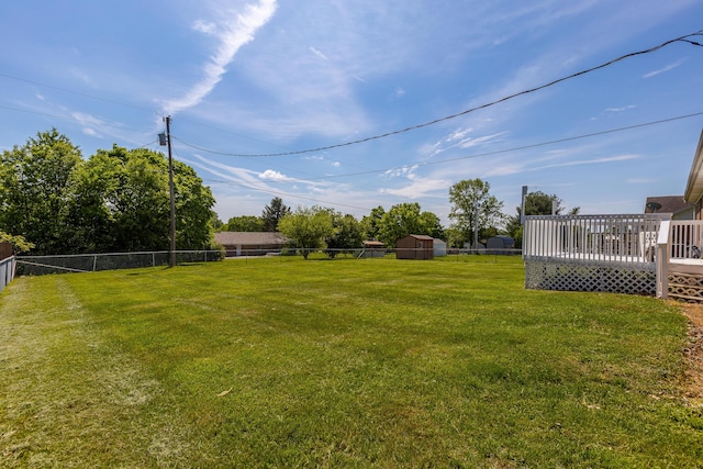 view of yard with a wooden deck