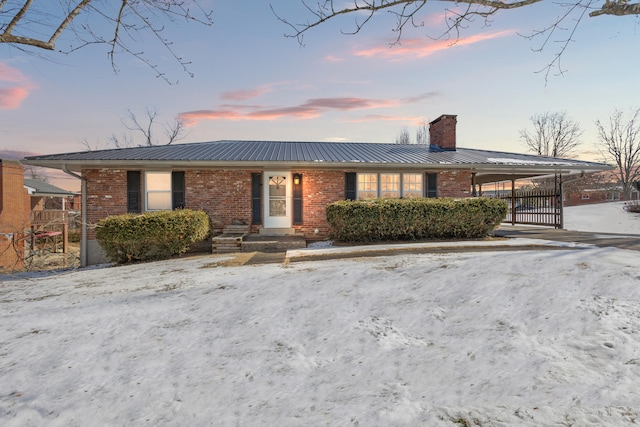 view of front of house with a carport