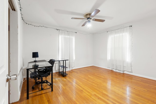 office area with hardwood / wood-style flooring and ceiling fan