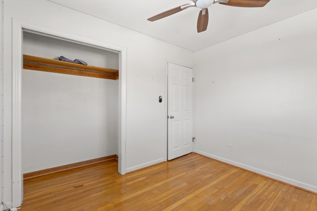 unfurnished bedroom with a closet, ceiling fan, and light wood-type flooring