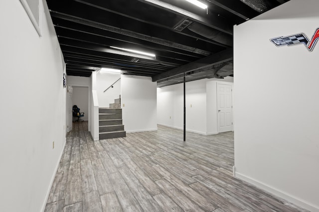 basement featuring hardwood / wood-style floors