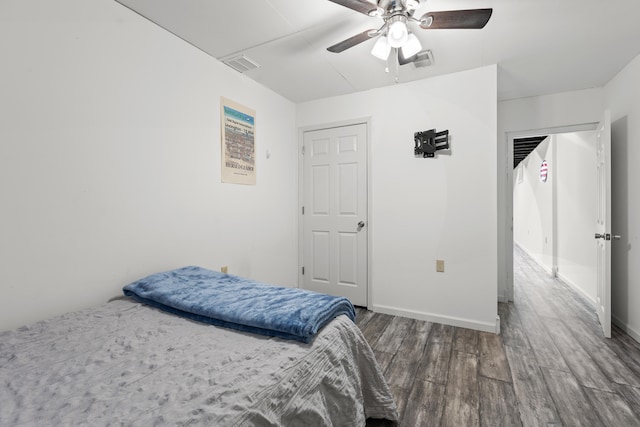 bedroom featuring hardwood / wood-style floors and ceiling fan