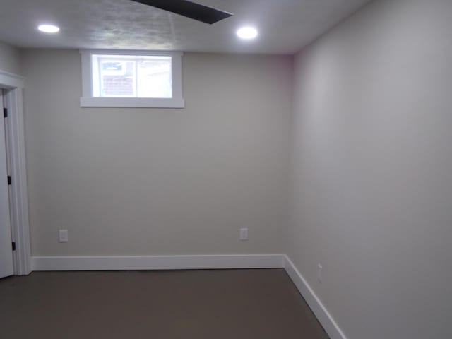 below grade area featuring baseboards and recessed lighting