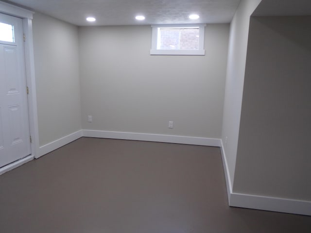 basement with recessed lighting and baseboards