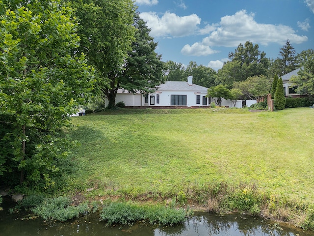 view of yard with a water view