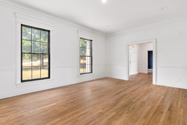 unfurnished room with light hardwood / wood-style floors and ornamental molding