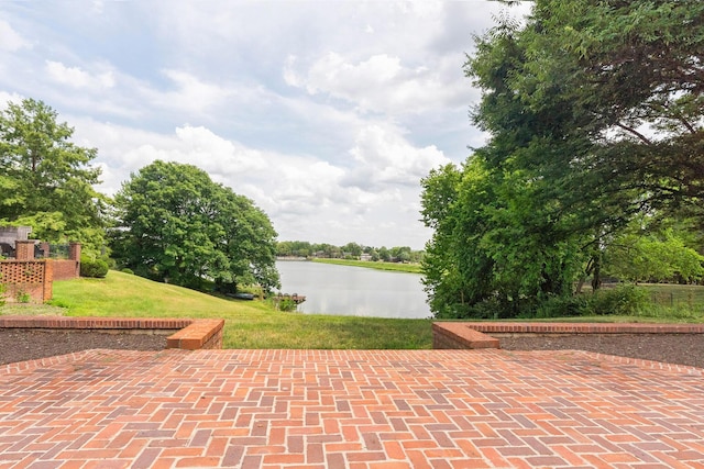 view of patio featuring a water view