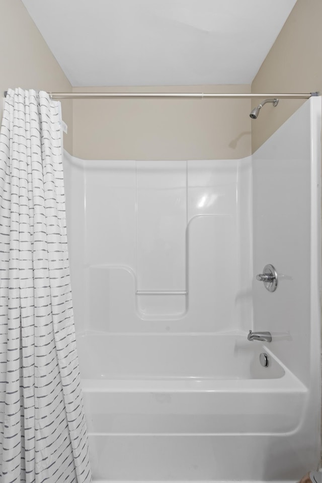 bathroom featuring shower / bath combination with curtain