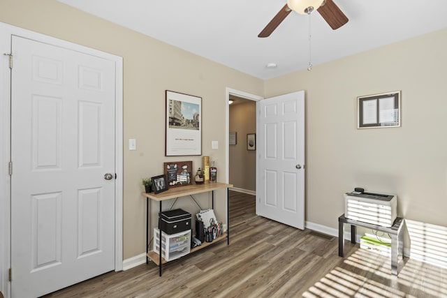 misc room featuring hardwood / wood-style flooring and ceiling fan