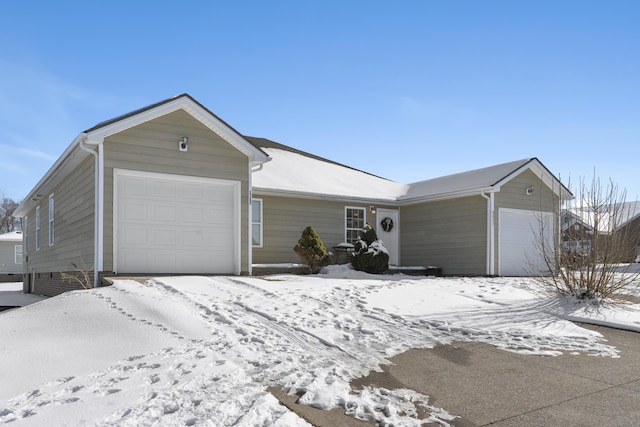 single story home featuring a garage