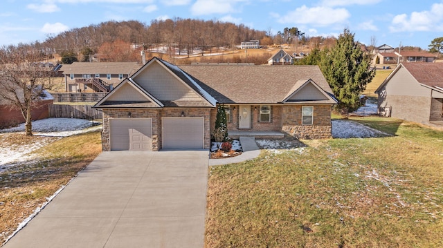 view of front of house featuring a garage and a front yard