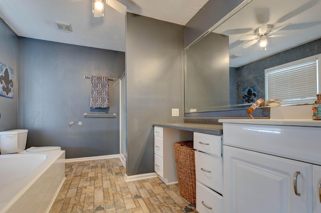 bathroom featuring vanity, ceiling fan, and an enclosed shower