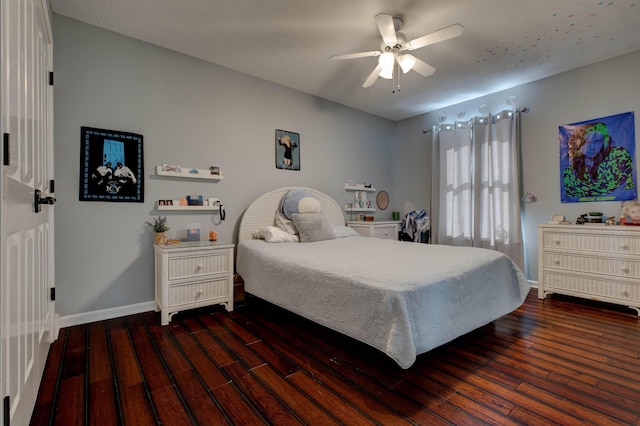 bedroom featuring ceiling fan and dark wood-type flooring