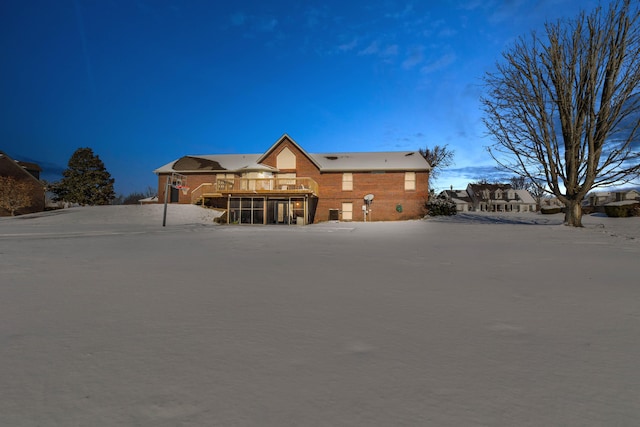 rear view of house with a wooden deck