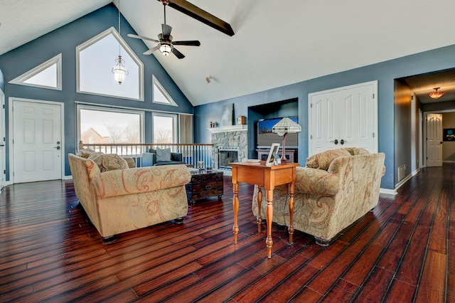 living room with ceiling fan, high vaulted ceiling, dark wood-type flooring, and a fireplace