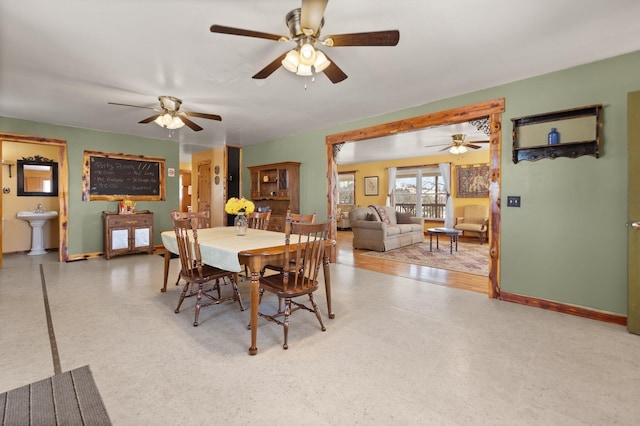 dining room with sink and ceiling fan