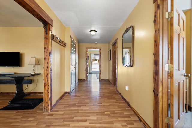 corridor featuring light hardwood / wood-style floors