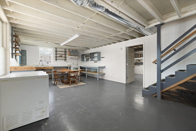 basement featuring sink and a workshop area