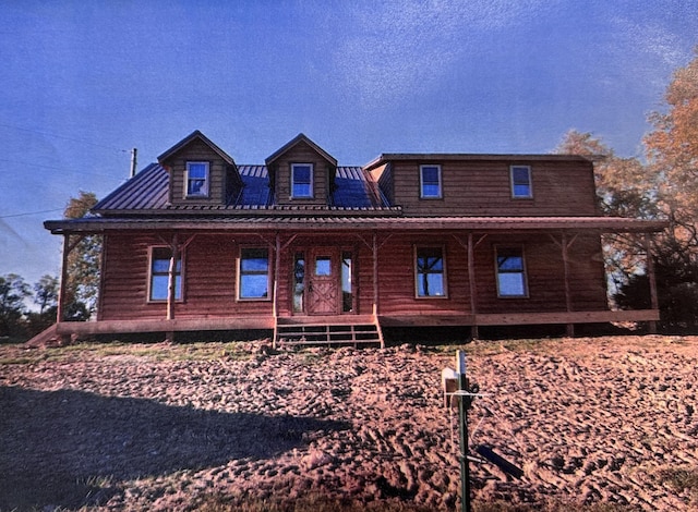 log home with covered porch