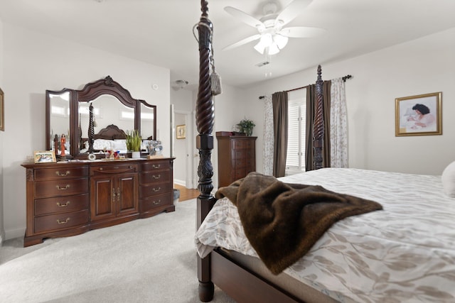 bedroom featuring light carpet and ceiling fan