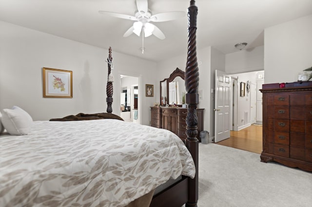 bedroom featuring ceiling fan and light colored carpet