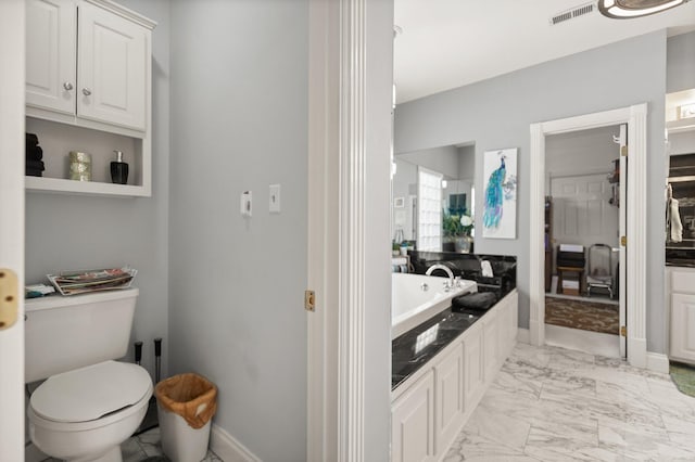 bathroom with a bath and toilet